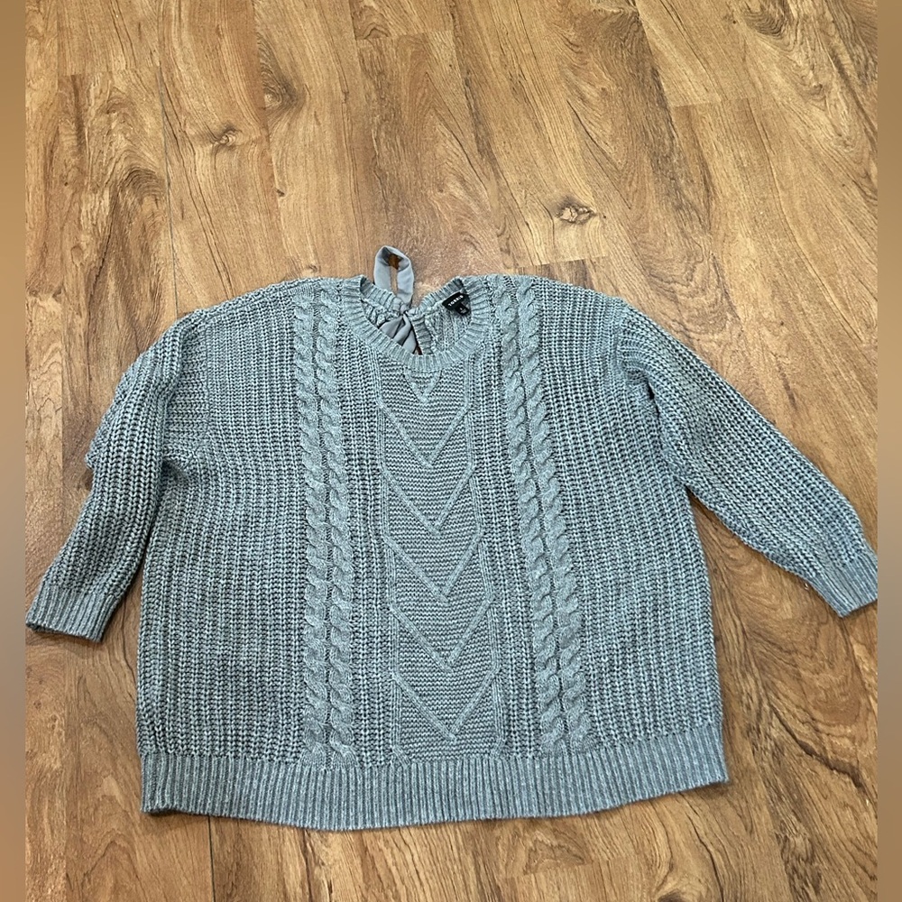 Sweater with open back and bow